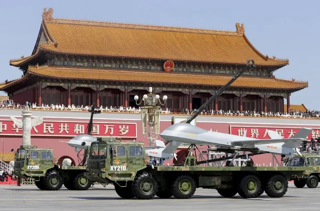 Military vehicles carrying Pterodactyl I unmanned aerial vehicles drive past the Tiananmen Gate during a military parade to mark the 70th anniversary of the end of World War Two, in Beijing, China, September 3, 2015. (Photo by Jason Lee/Reuters)