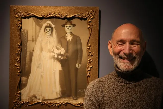 Collection owner Richard Harris stands in front of a work my Mexican artist Marcos Raya called Family Portrait : Wedding  at the “Death: A Self-portrait” exhibition at the Wellcome Collection on November 14, 2012 in London, England. The exhibition showcases 300 works from a unique collection by Richard Harris, a former antique print dealer from Chicago, devoted to the iconography of death. The display highlights art works, historical artifacts, anatomical illustrations and ephemera from around the world and opens on November 15, 2012 until February 24, 2013.  (Photo by Peter Macdiarmid)