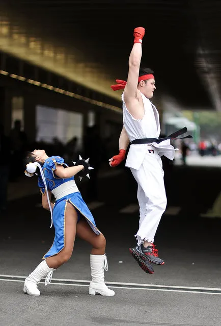 Comic Con attendees pose as Chun Li and Ryu from Street Fighter during the 2014 New York Comic Con at Jacob Javitz Center on October 10, 2014 in New York City. (Photo by Daniel Zuchnik/Getty Images)