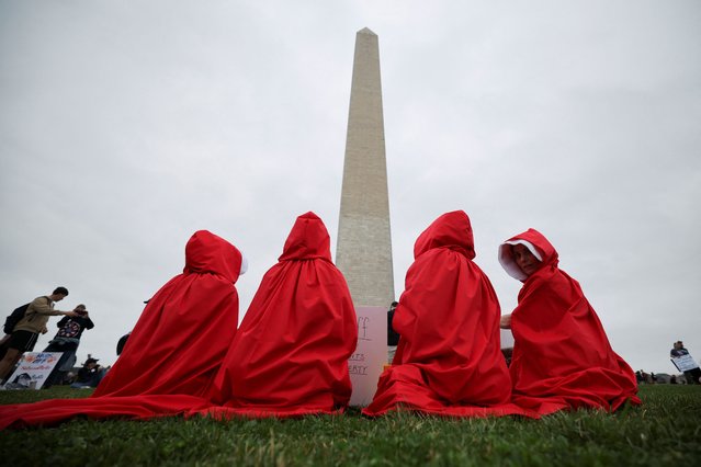 Demonstrators dressed as handmaidens from “The Handmaid's Tale” take part in a “Hands Off!” protest against U.S. President Donald Trump and his adviser Elon Musk on the Washington Monument grounds in Washington, D.C., U.S., April 5, 2025. (Photo by Carlos Barria/Reuters)
