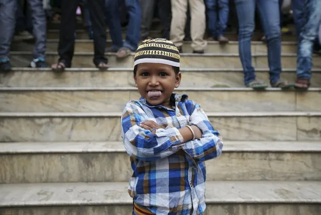 A Nepali Muslim boy stands on the stairs during the Eid al-Adha celebrations at the Kashmiri Takiya Jame mosque in Kathmandu, Nepal September 25, 2015. (Photo by Navesh Chitrakar/Reuters)