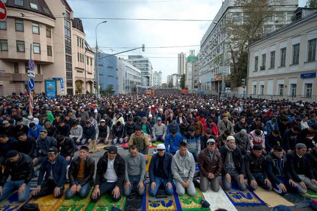 Muslims attend a morning prayer to mark Eid al-Adha in Moscow on September 12, 2016. Muslims are celebrating Eid al-Adha (the feast of sacrifice), the second of two Islamic holidays celebrated worldwide marking the end of the annual pilgrimage or Hajj to the Saudi holy city of Mecca. (Photo by Alexander Utkin/AFP Photo)