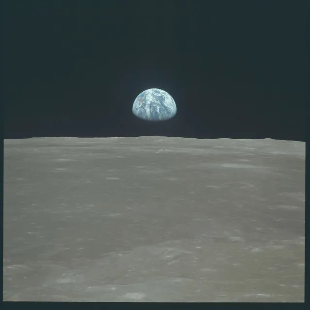 Earth rises above the moon's horizon during the Apollo 11 lunar mission in this July 1969 NASA handout photo. (Photo by Reuters/NASA)