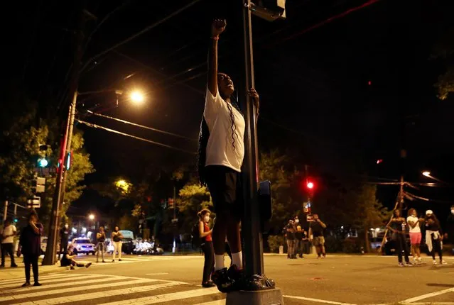 People gather outside of the 7th precinct to express their anger after Washington Metropolitan Police Department shot and killed a young Black man in South East DC, U.S. September 2, 2020. (Photo by Leah Millis/Reuters)