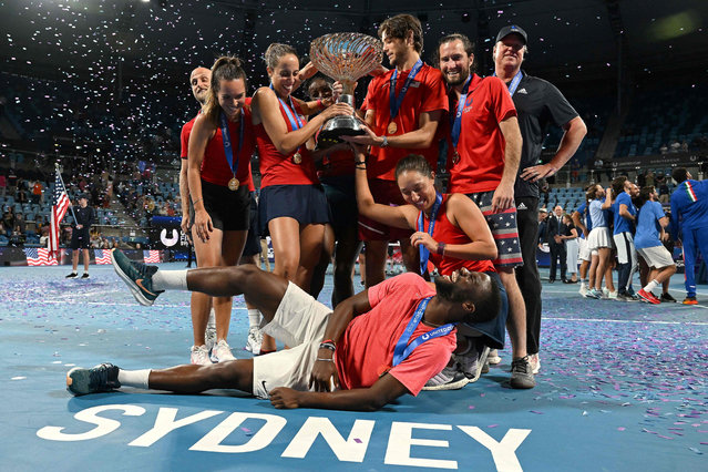Team US celebrates with the winning trophy of the United Cup after their finals against Italy in Sydney on January 8, 2023. (Photo by Saeed Khan/AFP Photo)