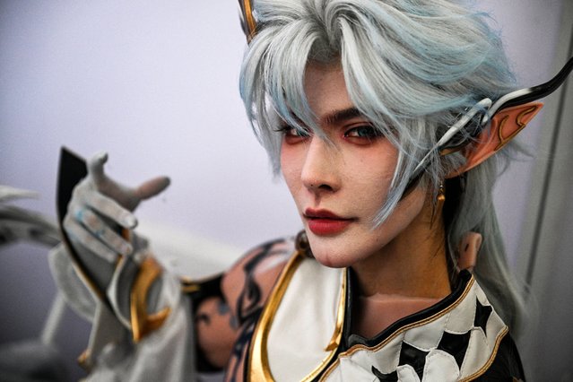 A cosplayer in the character of Zhuge Liang of a video game poses during ChinaJoy, known as China Digital Entertainment Expo and Conference, at the Shanghai New International Expo Centre in Shanghai on August 1, 2025. (Photo by Hector Retamal/AFP Photo)