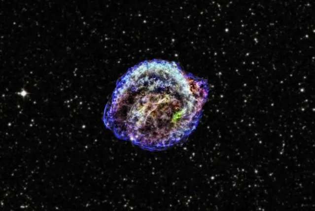 This supernova, discovered in 1604 by Johannes Kepler, belongs to an important class of objects that are used to measure the rate of expansion of the universe, known as Type 1a supernovae. The view you see here, released March 18, 2013 was produced using data from NASA's Chandra X-ray Observatory as well as infrared and optical imagery. The Chandra X-ray observations led astronomers to conclude that the supernova was triggered by interaction between a white dwarf and a red giant star. (Photo by CXC/NASA/JPL-Caltech)