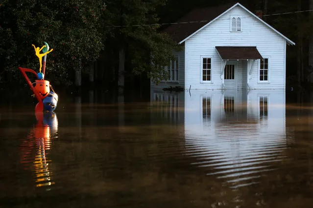 A flooded building is pictured after Hurricane Matthew passes in Lumberton, North Carolina, U.S., October 11, 2016. (Photo by Carlo Allegri/Reuters)