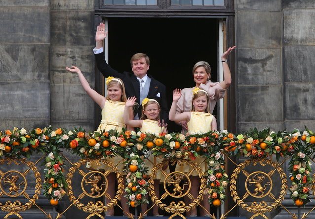 Dutch King Willem-Alexander and Queen Maxima appear on the balcony of the Royal Palace with their children, from left: Catharina-Amalia, Ariane, and Alexia in Amsterdam, The Netherlands, Tuesday April 30, 2013. Around a million people are expected to descend on the Dutch capital for a huge street party to celebrate the first new Dutch monarch in 33 years. (Photo by Dusan Vranic/AP Photo)
