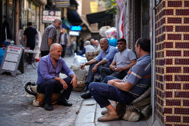 Porters take a break near the Grand Bazaar in Istanbul, Turkey, Thursday, September 25, 2025. (Photo by Emrah Gurel/AP Photo)