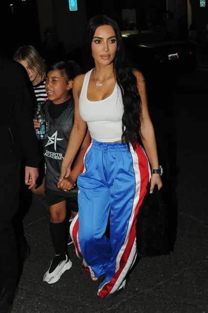 Kim Kardashian is spotted as she exits to a basketball game with North West in Los Angeles on April 22, 2023. The 42 year old wore a white tank top paired with blue track pants with red and white stripes going down the sides. (Photo by The Image Direct)
