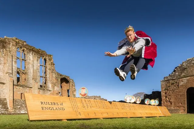 The Olympic track-and-field star, British track and field athlete Greg Rutherford jumps for joy after King Charles is added to English Heritage’s Rulers of England ruler in the last decade of April 2023. (Photo by English Heritage)