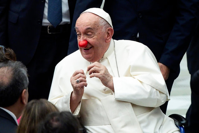 Pope Francis wears a red nose during the weekly general audience in the Paul VI Hall, Vatican City, on 21 August 2024. (Photo by Angelo Carconi/EPA/EFE)