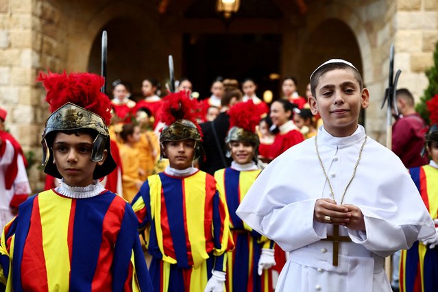 A child dressed as the pope and others as Swiss Guards, gather on the day Pope Leo XIV visits De La Croix Psychiatric Hospital during his first apostolic journey, in Jal el-Dib, Lebanon on December 2, 2025. (Photo by Yara Nardi/Reuters)