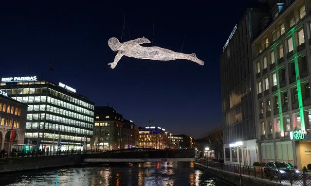 The project 'Voyageurs' by artist Cedric Le Borgne is on display in Geneva, Switzerland, 02 December 2015, as part of the Geneva Lux Festival. Light and decoration projects create a christmas atmosphere around the Geneva lake and in the city centre during the second edition of the festival. (Photo by Martial Trezzini/EPA)