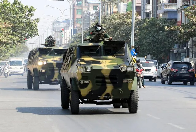 Myanmar Army armored vehicles drive in a street after the military seized power in a coup in Mandalay, Myanmar, February 3, 2021. On 1 February, Myanmar's military imposed a curfew across the country shortly after assuming power over the country in a coup and declared a year-long state of emergency. Myanmar soldiers arrested democratic leader Suu Kyi and other senior members of the ruling party after days of growing tension. (Photo by Reuters/Stringer)