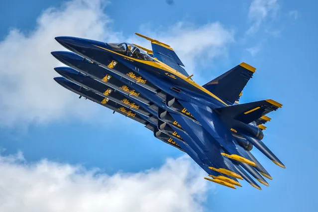 The U.S. Navy flight demonstration squadron, the Blue Angels, perform during the Vectren Dayton Air Show in Dayton, Ohio on June 26, 2018. (Photo by Mass Communication Specialist 2nd Class Timothy Schumaker/Reuters/U.S. Navy)