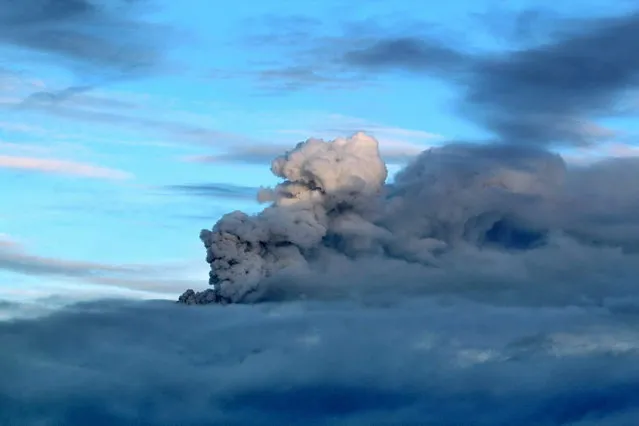 A plume of volcanic ash rises from the Popocatepetl volcano during a brief break from ongoing cloud cover as seen from the town of San Mateo Ozolco, Mexico, Saturday, July 6, 2013.  Just east of Mexico City, the volcano has spit out a cloud of ash and vapor 2 miles (3 kilometers) high over several days of eruptions. Mexico's National Center for Disaster Prevention raised the volcano alert from Stage 2 Yellow to Stage 3 Yellow, the final step before a Red alert, when possible evacuations could be ordered. (Photo by Arturo Andrade/AP Photo)