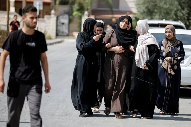 Palestinian women react during an Israeli military operation in Jenin, in the Israeli-occupied West Bank on July 3, 2023. (Photo by Raneen Sawafta/Reuters)