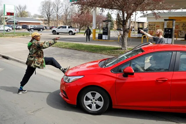 Phoenix Robles confronts a passerby down the street from the Brooklyn Center Police Department the weekend before closing arguments in the Derek Chauvin trial, and as protests continue demanding justice for Daunte Wright, in Brooklyn Center, Minnesota, U.S., April 18, 2021. (Photo by Nicholas Pfosi/Reuters)