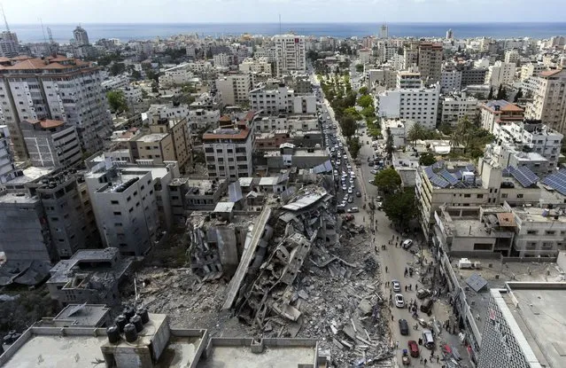 An aerial view of a destroyed building after it was hit last week by Israeli airstrikes, in Gaza City, Saturday, May 22, 2021. (Photo by Khalil Hamra/AP Photo)