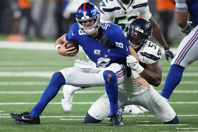 New York Giants quarterback Daniel Jones (8) is sacked by Seattle Seahawks linebacker Boye Mafe (53) during the fourth quarter of an NFL football game, Monday, October 2, 2023, in East Rutherford, N.J. (Photo by Frank Franklin II)/AP Photo