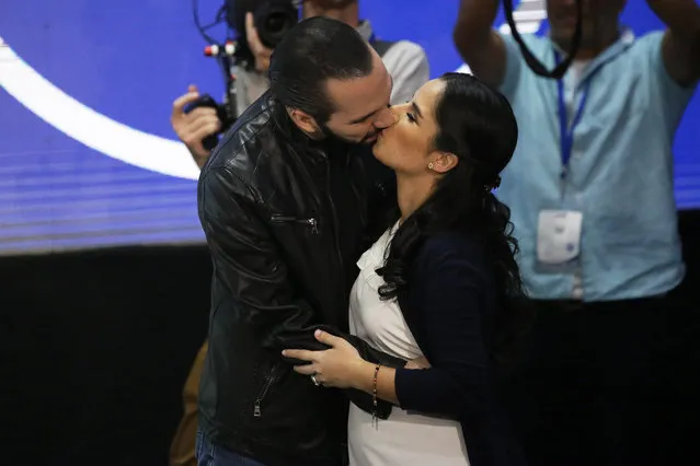 Presidential frontrunner Nayib Bukele, of the Grand Alliance for National Unity, kisses his wife Gabriela before giving a press conference, in San Salvador, El Salvador, February 3, 2019. Bukele, a former mayor of El Salvador's capital, romped to victory in Sunday's presidential election, winning more votes than his two closest rivals combined to end a quarter century of two-party dominance in the crime-plagued Central America nation. (Photo by Moises Castillo/AP Photo)