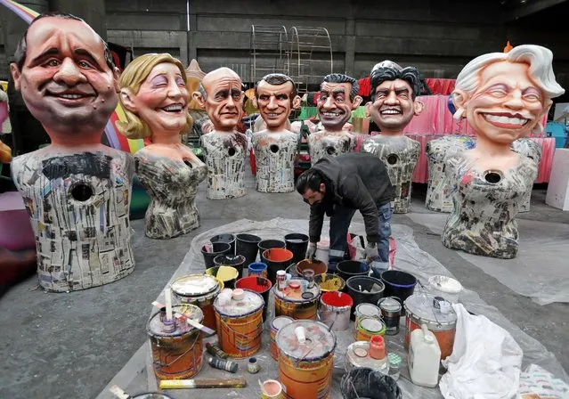 A worker puts the final touches to giant figures of French politicians (L-R) French President Francois Hollande, Marine Le Pen, Alain Juppe, Emmanuel Macron, Nicolas Sarkozy, Jean-Luc Melenchon and Michele Alliot-Marie during preparations for the carnival parade in Nice, France, January 26, 2017. (Photo by Eric Gaillard/Reuters)