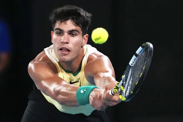 Carlos Alcaraz of Spain plays a backhand return to Richard Gasquet of France during their first round match at the Australian Open tennis championships at Melbourne Park, Melbourne, Australia, Tuesday, January 16, 2024. (Photo by Andy Wong/AP Photo)
