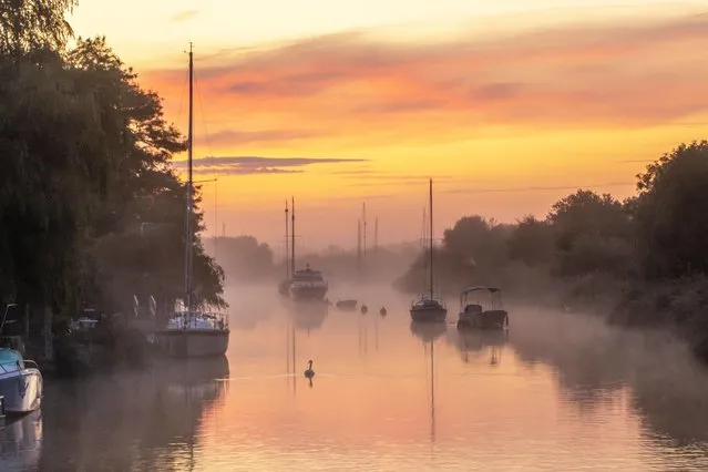 Sunrise over the River Frome in Wareham, Dorset on September 12, 2021. Today is expected to be cloudy with outbreaks of rain across the country. (Photo by Rachel Baker/BNPS Press Agency)