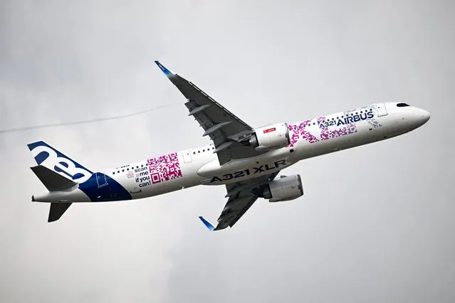 This photograph taken on June 19, 2023 shows a demonstration of the Airbus A321 XLR as French President visits the International Paris Air Show at the Paris Le Bourget Airport. (Photo by Emmanuel Dunand/AFP Photo)