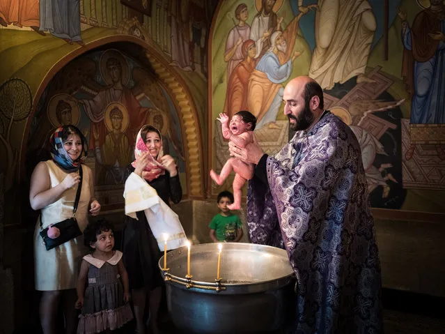Culture category, open shortlist. “Georgian baptism”. An infant is baptised according to the Orthodox rite in a church in Tbilisi, Georgia. (Photo and caption by Beniamino Pisati/2017 Sony World Photography Awards)