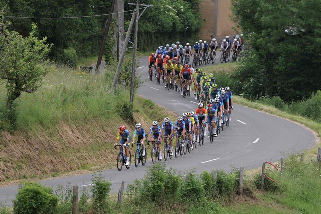 The pack rides during the fifth stage of the 76th edition of the Criterium du Dauphine cycling race, 167km between Amplepuis and Saint-Priest, central France, on June 6, 2024. (Photo by Thomas Samson/AFP Photo)