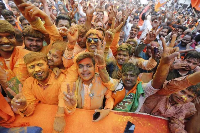 Bharatiya Janata Party (BJP) workers celebrate in Lucknow, India, Thursday, March 10, 2022. India's election authority started counting votes Thursday in five states' elections that are a crucial test for Prime Minister Narendra Modi's Hindu nationalist Bharatiya Janata Party before national elections in 2024. All results are expected to be available later in the day. (Photo by Rajesh Kumar Singh/AP Photo)