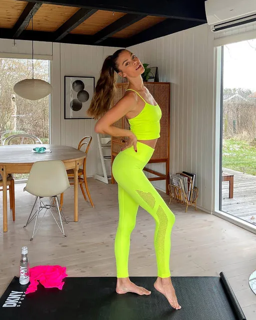 Danish model, known for her appearances in the “Sports Illustrated Swimsuit Issue” Nina Agdal prepares to work out in a neon-green ensemble in the last decade of March 2022. (Photo by ninaagdal/Instagram)