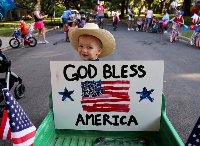 Niels Jacobsen, 3, waits for the Old Oaks neighborhood parade to begin on the Fourth of July, in Waco, Texas, on Thursday, July 4, 2024. The parade is over thirty years old. (Photo by Jerry Larson/AP Photo)