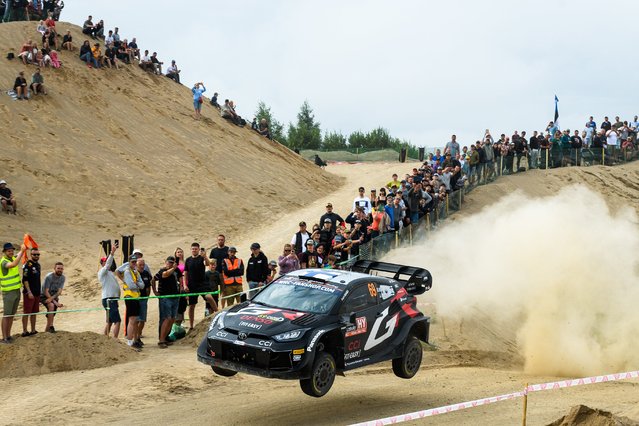 Kalle Rovanpera of Finland and his co-driver Jonne Halttunen of Finland steer their Toyota GR Yaris Rally1 HYBRID during SS17 Krogzemji at the WRC TET Rally Latvia WRC event organised the first time in Latvia, on July 21, 2024 in Krogzemji, Priekule, Latvia. (Photo by Gints Ivuskans/AFP Photo)