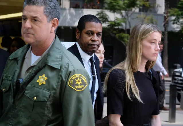 Actress Amber Heard leaves Los Angeles Superior Court court on Friday, May 27, 2016, after giving a sworn declaration that her husband Johnny Depp threw her cellphone at her during a fight Saturday, striking her cheek and eye. The judge ordered Depp to stay away from his estranged wife and ruled that Depp shouldn't try to contact Heard until a hearing is conducted on June 17. Heard filed for divorce on Monday. (Photo by Richard Vogel/AP Photo)