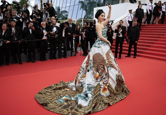 Chinese actress Fan Bingbing waves as she arrives for the screening of the film “Jeanne Du Barry” during the 76th edition of the Cannes Film Festival in Cannes, southern France, on May 16, 2023. (Photo by Valery Hache/AFP Photo)