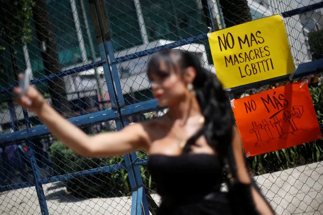 A sign that reads “No more massacres LGBT” is seen to remember the victims of the Pulse nightclub mass shooting in Orlando, near the U.S. Embassy in Mexico City, Mexico, June 14, 2016. (Photo by Edgard Garrido/Reuters)