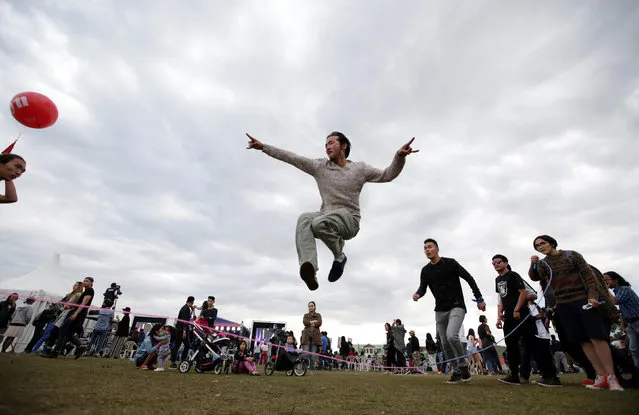 Revellers play skiping at the Play Time 2016 music festival on the outskirts of Ulaanbaatar, Mongolia, June 26, 2016. (Photo by Jason Lee/Reuters)