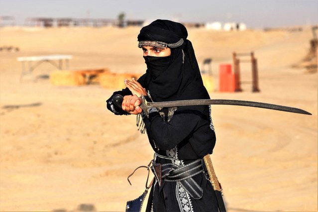 Saudi equestrian Noura Al-Jabr demonstrates her sword fighting skills at a training centre in Dammam, in Saudi Arabia's eastern province on August 14, 2023. Jabr organises mounted archery and tent-pegging training sessions that are especially popular among women. (Photo by Fayez Nureldine/AFP Photo)