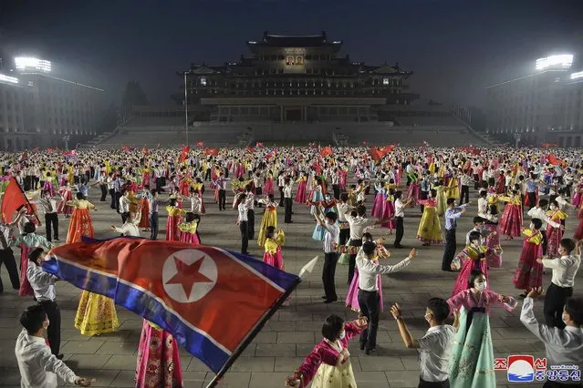 In this photo provided by the North Korean government, youth gather to celebrate the 69th anniversary of the signing of the ceasefire armistice that ends the fighting in the Korean War, is held in Pyongyang, North Korea Wednesday, July 27, 2022. (Photo by Korean Central News Agency/Korea News Service via AP Photo)