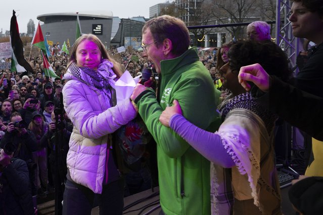 Climate activist Greta Thunberg is interrupted by a climate activist after Thunberg expressed solidarity with the Palestinians as tens of thousands of people marched through Amsterdam, Netherlands, Sunday, November 12, 2023, to call for more action to tackle climate change. Thunberg was among the speakers at the march that comes 10 days before national elections in the Netherlands. (Photo by Peter Dejong/AP Photo)