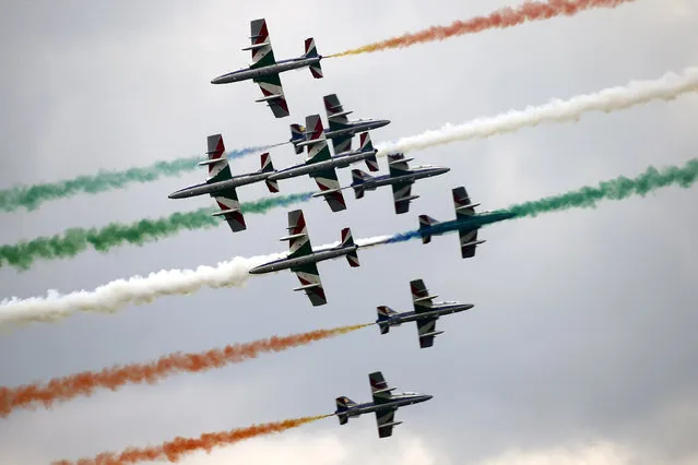 Members of the Italian aerobatic team Frecce Tricolori perform during the AirPower 13 air show at the Hinterstoisser air base in Zeltweg, Austria, June 28, 2013. (Photo by Dominic Ebenbichler/Reuters)