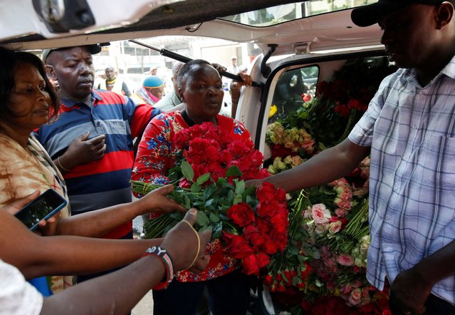 People buy roses from a florist to mark Valentine's Day celebrations in Nairobi, Kenya, on February 14, 2025. (Photo by Monicah Mwangi/Reuters)