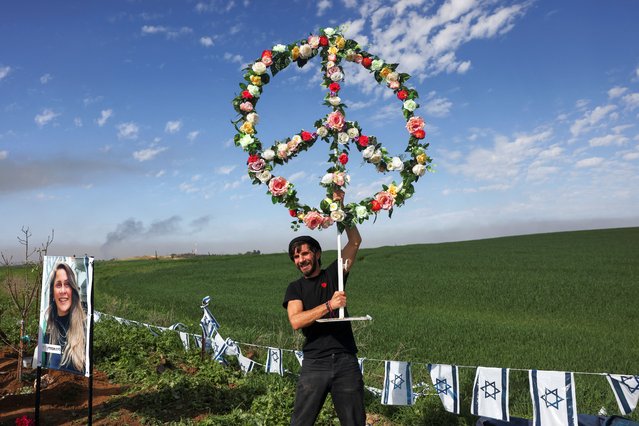 The family of Liraz Assulin, 38, who fled from the Nova festival and was killed during the deadly October 7 attack by gunmen from Palestinian Islamist group Hamas, creates a memorial for her, near Kibbutz Kfar Aza in southern Israel, on January 21, 2024. (Photo by Ronen Zvulun/Reuters)