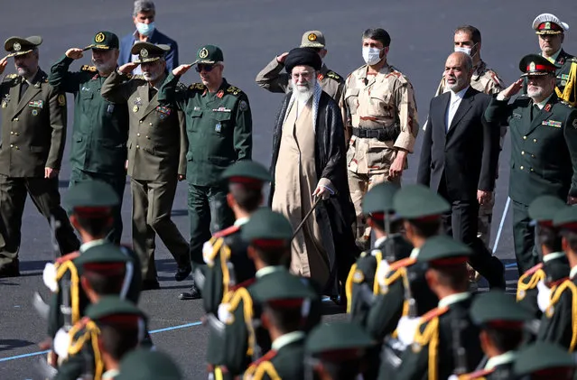 In this picture released by the official website of the office of the Iranian supreme leader, Supreme Leader Ayatollah Ali Khamenei, center, reviews a group of armed forces cadets during their graduation ceremony accompanied by commanders of the armed forces, at the police academy in Tehran, Iran, Monday, October 3, 2022. Khamenei responded publicly on Monday to the biggest protests in Iran in years, breaking weeks of silence to condemn what he called “rioting” and accuse the U.S. and Israel of planning the protests. (Photo by Office of the Iranian Supreme Leader via AP Photo)