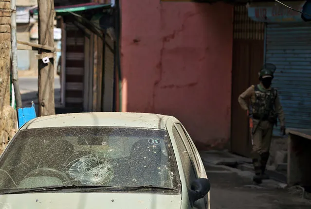 A car is seen damaged after a night of clashes between protesters and security forces in Srinagar as the city remains under curfew following weeks of violence in Kashmir, August 21, 2016. (Photo by Cathal McNaughton/Reuters)