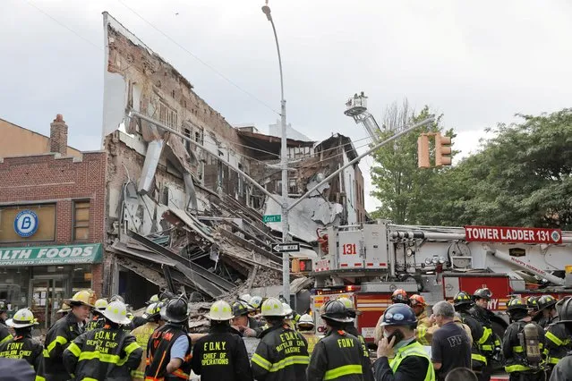 Members of the New York Fire Department (FDNY) inspect a collapsed building in the Brooklyn borough of New York City, New York U.S., July 1, 2020. (Photo by Lucas Jackson/Reuters)